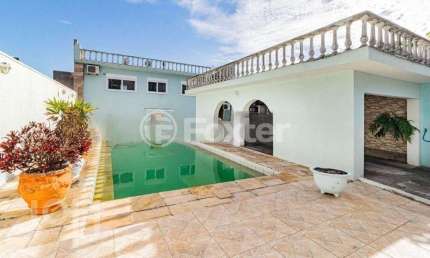 Casa com 4 quartos à venda na Rua Miracema, 134, Chácara das Pedras, Porto Alegre, 280 m2 por R$ 900.000