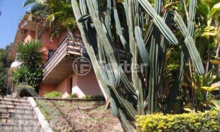 Casa com 4 quartos à venda na Rua Alcebíades Antônio dos Santos, 260, Nonoai, Porto Alegre, 240 m2 por R$ 900.000