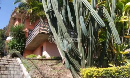 Casa com 4 quartos à venda na rua alcebíades antônio dos santos, 260, nonoai, porto alegre, 240 m2 por r$ 900.000