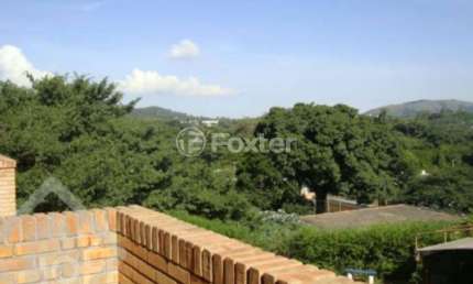 Casa em condomínio fechado com 3 quartos à venda na Avenida Vicente Monteggia, 2212, Cavalhada, Porto Alegre, 139 m2 por R$ 700.000