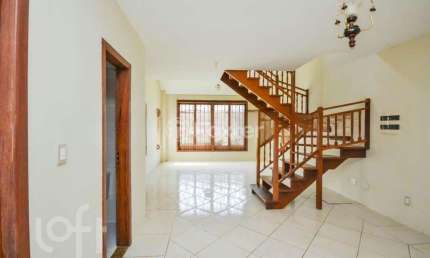 Casa em condomínio fechado com 3 quartos à venda na Avenida Vicente Monteggia, 1020, Cavalhada, Porto Alegre, 160 m2 por R$ 550.000