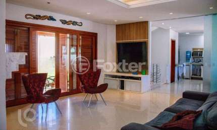 Casa com 3 quartos à venda na Rua País de Gales, 504, Marechal Rondon, Canoas, 204 m2 por R$ 1.590.000