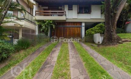 Casa com 4 quartos à venda na Rua Carlos Trein Filho, 1255, Auxiliadora, Porto Alegre, 440 m2 por R$ 3.990.000