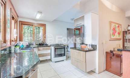 Casa com 4 quartos à venda na Avenida Vicente Monteggia, 2000, Cavalhada, Porto Alegre, 280 m2 por R$ 1.200.000