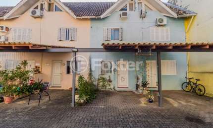 Casa em condomínio fechado com 3 quartos à venda na Rua Doutor Pereira Neto, 1761, Tristeza, Porto Alegre, 79 m2 por R$ 335.000