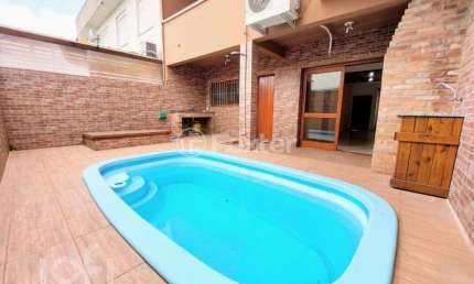 Casa em condomínio fechado com 3 quartos à venda na Rua Guatambu, 106, Hípica, Porto Alegre, 209 m2 por R$ 650.000