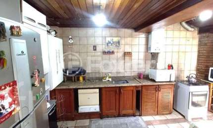 Casa em condomínio fechado com 3 quartos à venda na Avenida Juca Batista, 1490, Cavalhada, Porto Alegre, 122 m2 por R$ 650.000