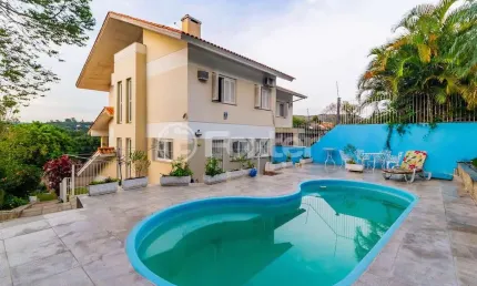 Casa com 3 quartos à venda na Rua Professor Antônio José Remião, 263, Espírito Santo, Porto Alegre, 210 m2 por R$ 850.000