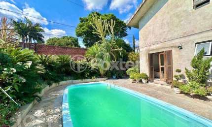 Casa com 4 quartos à venda na Rua Guilherme Vielitz, 467, Canudos, Novo Hamburgo, 220 m2 por R$ 585.000