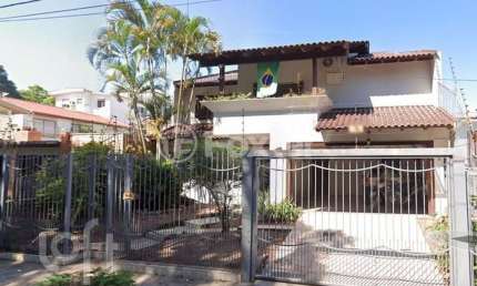 Casa com 3 quartos à venda na Rua Erebango, 114, Nonoai, Porto Alegre, 370 m2 por R$ 710.000
