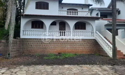 Casa em condomínio fechado com 3 quartos à venda na Avenida Senador Salgado Filho, 6863, São Lucas, Viamão, 300 m2 por R$ 1.000.000