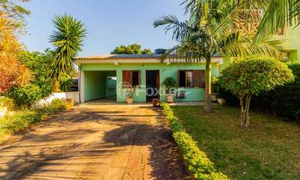 Casa com 4 quartos à venda na Rua Monte Claro, 106, Hípica, Porto Alegre, 150 m2 por R$ 456.000