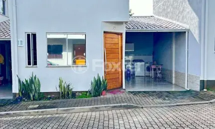 Casa em condomínio fechado com 2 quartos à venda na Avenida Prefeito Barreto Viana, 413, Cecília, Viamão, 71 m2 por R$ 265.000