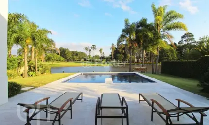 Casa em condomínio fechado com 3 quartos à venda na avenida juca batista, 8000, belém novo, porto alegre, 450 m2 por r$ 5.250.000
