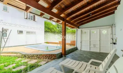 Casa em condomínio fechado com 5 quartos à venda na avenida juca batista, 1200, belém novo, porto alegre, 300 m2 por r$ 1.250.000