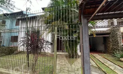 Casa com 4 quartos à venda na Rua São Caetano, 101, Marechal Rondon, Canoas, 360 m2 por R$ 1.000.000