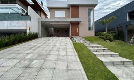 Casa em condomínio fechado com 3 quartos à venda na Avenida Senador Salgado Filho, 8500, Querência, Viamão, 399 m2 por R$ 1.350.000