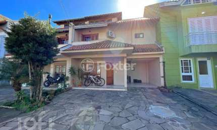 Casa em condomínio fechado com 3 quartos à venda na Avenida Juca Batista, 1458, Cavalhada, Porto Alegre, 153 m2 por R$ 749.000