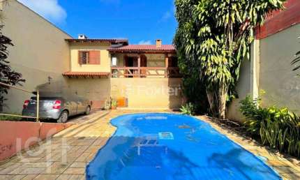 Casa com 4 quartos à venda na Rua Francisca Lechner, 343, Parque Santa Fé, Porto Alegre, 263 m2 por R$ 650.000