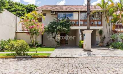 Casa em condomínio fechado com 3 quartos à venda na Avenida Eduardo Prado, 2050, Cavalhada, Porto Alegre, 233 m2 por R$ 1.080.000