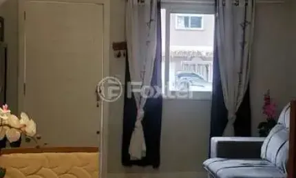 Casa em condomínio fechado com 2 quartos à venda na Rua Giobatta Giuseppe Petracco, 411, Vila Nova, Porto Alegre, 96 m2 por R$ 294.000