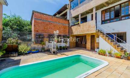 Casa com 3 quartos à venda na Rua Vinte e Seis de Dezembro, 648, Vila São José, Porto Alegre, 186 m2 por R$ 520.000