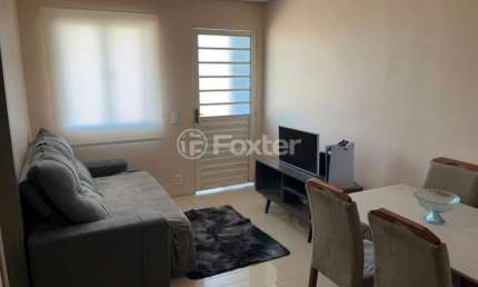 Casa em condomínio fechado com 2 quartos à venda na Rua Roberto Francisco Behrens, 200, Mato Grande, Canoas, 50 m2 por R$ 198.000