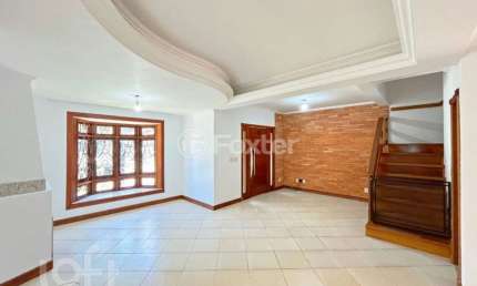 Casa em condomínio fechado com 3 quartos à venda na Rua Roberto Santini, 194, Hípica, Porto Alegre, 138 m2 por R$ 720.000