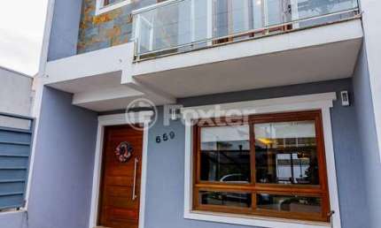 Casa em condomínio fechado com 3 quartos à venda na Rua Pau-Brasil, 659, Hípica, Porto Alegre, 133 m2 por R$ 599.000