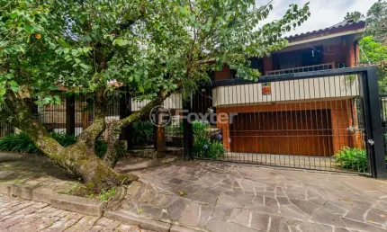 Casa com 4 quartos à venda na Rua Alcebíades Antônio dos Santos, 157, Nonoai, Porto Alegre, 362 m2 por R$ 1.650.000