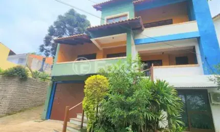 Casa com 3 quartos à venda na rua theonila carvalho da motta, 80, parque santa fé, porto alegre, 438 m2 por r$ 1.150.000