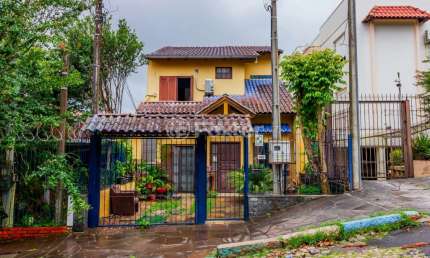 Casa com 4 quartos à venda na Rua Antônio Ribeiro, 160, Santo Antônio, Porto Alegre, 180 m2 por R$ 950.000