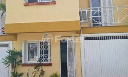 Casa em condomínio fechado com 3 quartos à venda na Rua Barbosa Neto, 205, Cavalhada, Porto Alegre, 129 m2 por R$ 570.000
