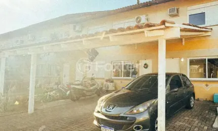 Casa em condomínio fechado com 3 quartos à venda na Rua Doutor Tancredo Neves, 160, Fátima, Canoas, 93 m2 por R$ 375.000