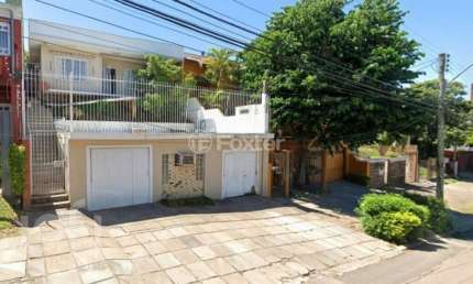 Casa com 3 quartos à venda na Rua Doutor Barbosa Gonçalves, 41, Chácara das Pedras, Porto Alegre, 141 m2 por R$ 900.000