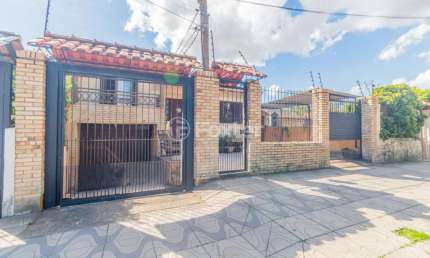 Casa com 4 quartos à venda na Rua Xavier da Cunha, 581, Nonoai, Porto Alegre, 193 m2 por R$ 689.000