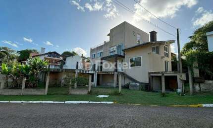 Casa em condomínio fechado com 4 quartos à venda na Rua Cangerana, 400, São Lucas, Viamão, 400 m2 por R$ 695.000
