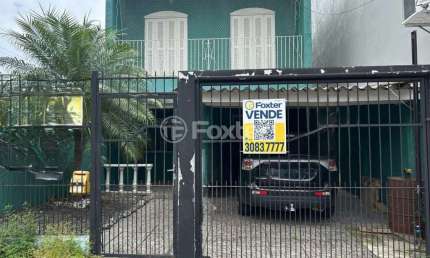 Casa com 4 quartos à venda na Rua Hermínio Machado, 653, Jardim Algarve, Alvorada, 192 m2 por R$ 490.000