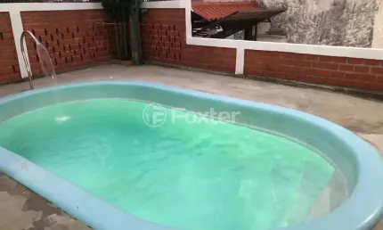 Casa com 3 quartos à venda na Avenida Tiradentes, 970, Aparecida, Alvorada, 200 m2 por R$ 419.000