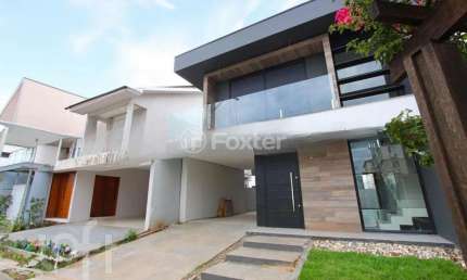Casa em condomínio fechado com 3 quartos à venda na Rua Dom João Becker, 1836, Fátima, Canoas, 207 m2 por R$ 1.269.990