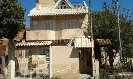 Casa com 4 quartos à venda na Rua Querubim Costa, 113, Coronel Aparício Borges, Porto Alegre, 250 m2 por R$ 554.000