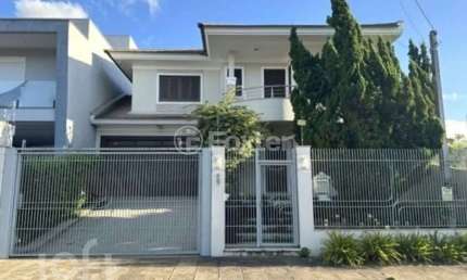 Casa com 3 quartos à venda na Rua País de Gales, 627, Marechal Rondon, Canoas, 196 m2 por R$ 1.350.000
