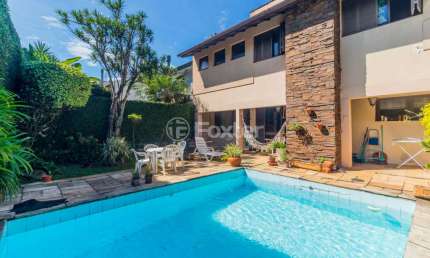 Casa com 4 quartos à venda na Rua Araponga, 28, Chácara das Pedras, Porto Alegre, 387 m2 por R$ 2.200.000