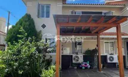 Casa em condomínio fechado com 3 quartos à venda na Avenida João Ferreira Jardim, 140, Parque Santa Fé, Porto Alegre, 116 m2 por R$ 379.000