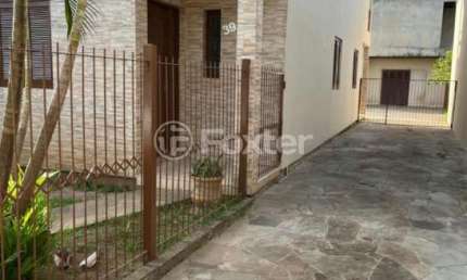 Casa com 4 quartos à venda na Rua Japeju, 39, Arquipélago, Porto Alegre, 180 m2 por R$ 1.235.000