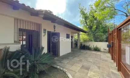 Casa com 3 quartos à venda na Avenida Ararangua, 126, Guarujá, Porto Alegre, 210 m2 por R$ 425.000