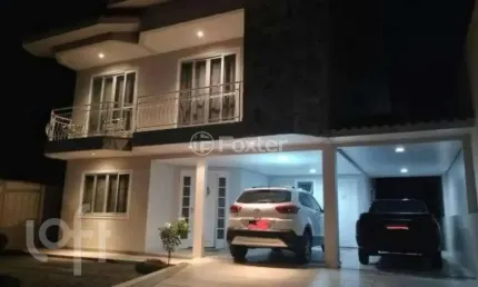 Casa com 3 quartos à venda na Rua Graciliano Carlos de Quadros, 164, Centro, Palhoça, 209 m2 por R$ 1.070.000
