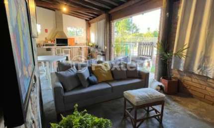 Casa em condomínio fechado com 2 quartos à venda na Rua Sol Nascente, 80, Martinica, Viamão, 110 m2 por R$ 570.000