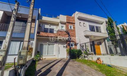 Casa em condomínio fechado com 3 quartos à venda na Rua Roberto Santini, 124, Hípica, Porto Alegre, 146 m2 por R$ 740.000