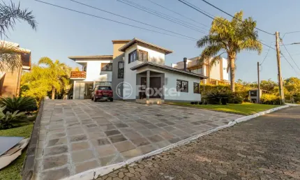 Casa em condomínio fechado com 3 quartos à venda na Estrada Capitão Gentil Machado de Godoy, 4500, Vila Elsa, Viamão, 204 m2 por R$ 1.300.000